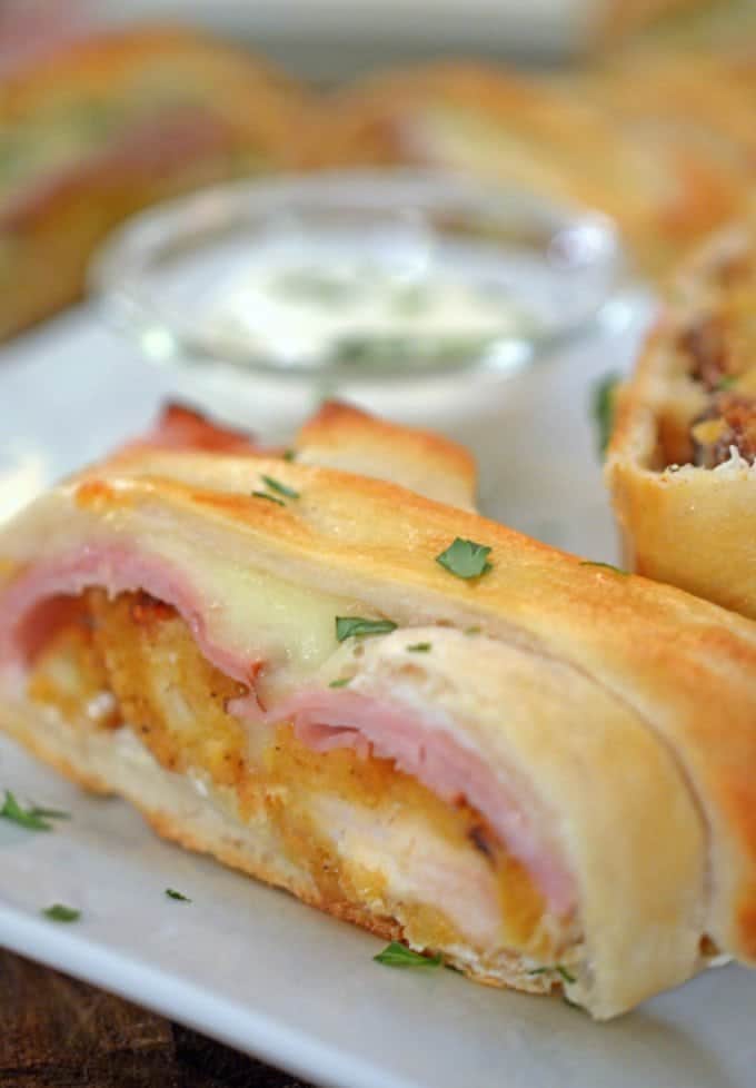 A close up of a plate, with Chicken and Stromboli