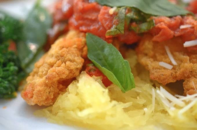 A close up of a plate of food with Chicken and Spaghetti squash