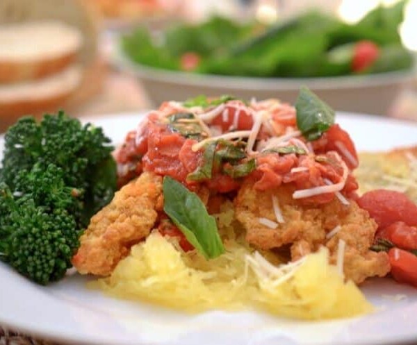 A close up of a plate of food with broccoli, with Basil and Prosciutto