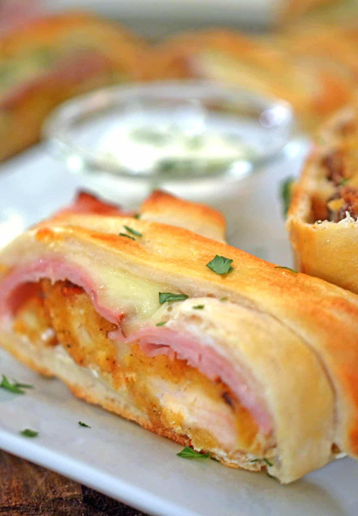 A slice of chicken stromboli on a plate.
