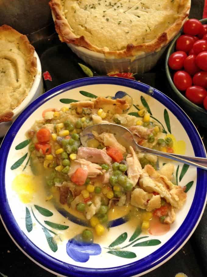 A plate of food with a spoon.