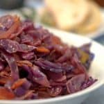 A close up of bowl of red cabbage and bacon