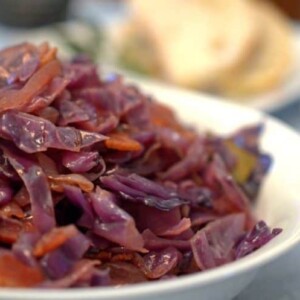 A close up of bowl of red cabbage and bacon