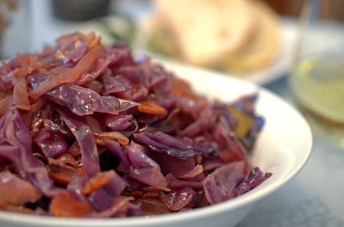 A close up of bowl of red cabbage and bacon