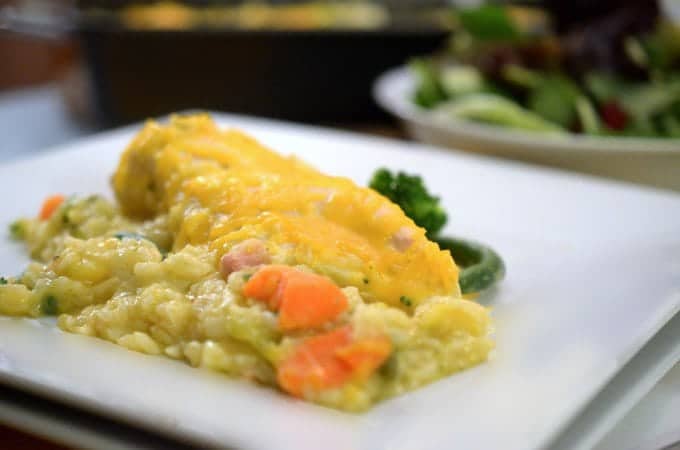 A close up of a plate of chicken and rice casserole.