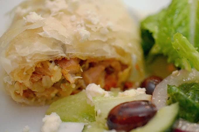 A close-up of pastry-wrapped chicken.