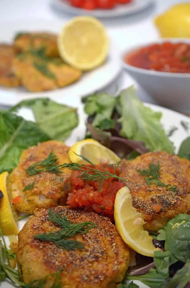 A plate of fish cakes with dill.