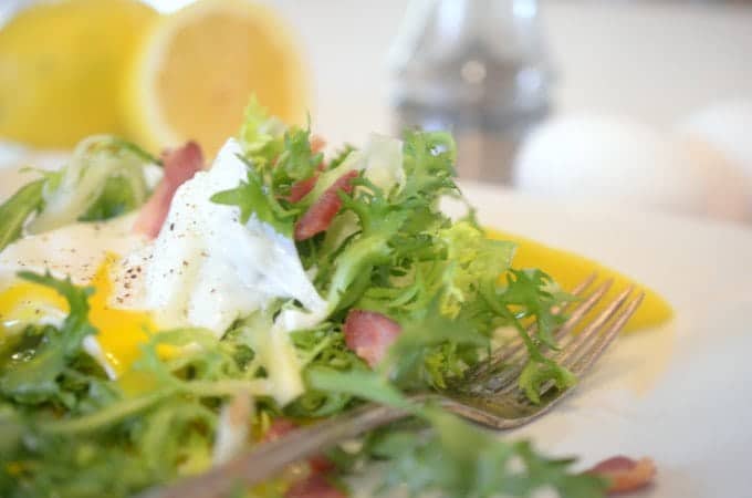 A close up of a bowl of salad