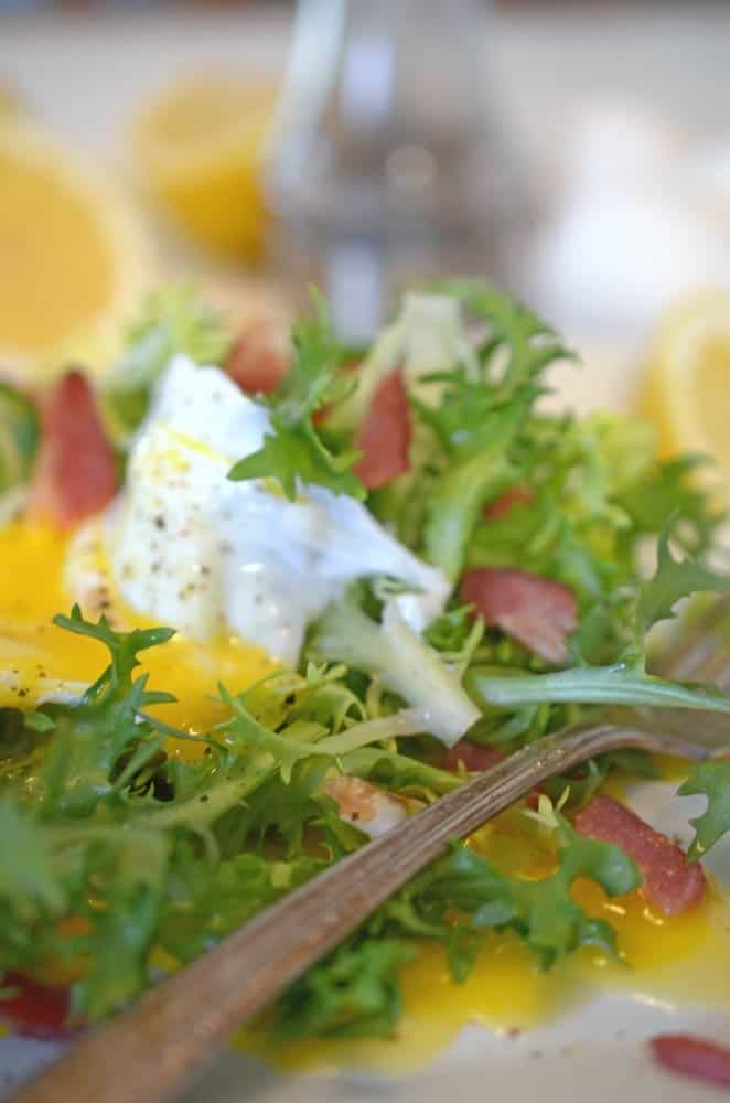 A plate of lettuce with creamy dressing.