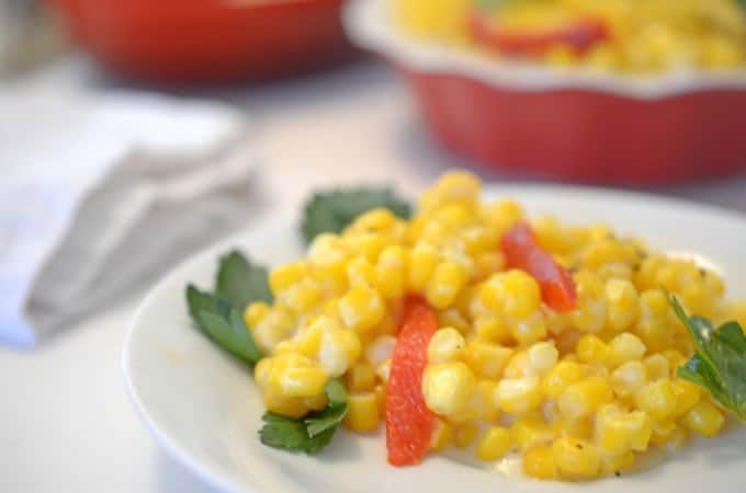 close up of cream corn on a plate