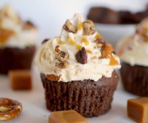 A close-up of a piece of chocolate  cupcake on a plate, with Chocolate.