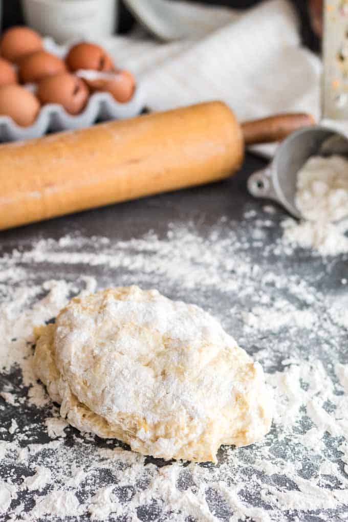 Ball of pierogi dough with rolling pin.