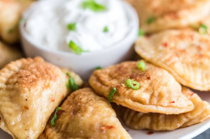 Platter or piergoi with chives and sour cream.