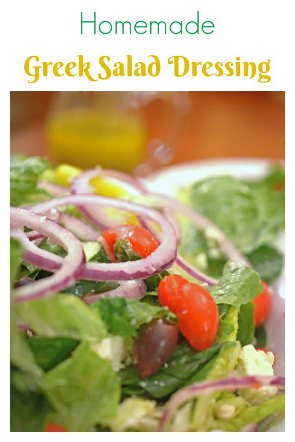 A bowl of salad, with Greek salad and Salad dressing.