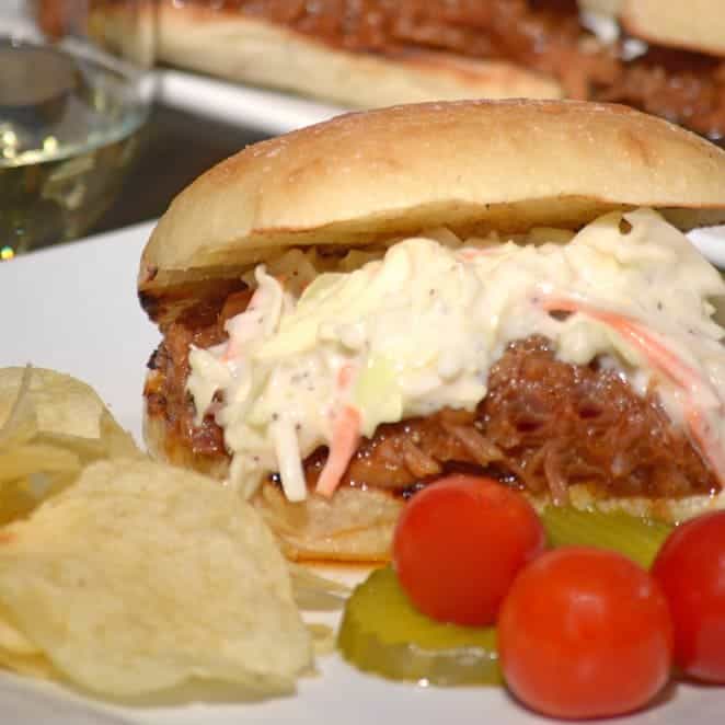 A close up of a pulled pork sandwich.