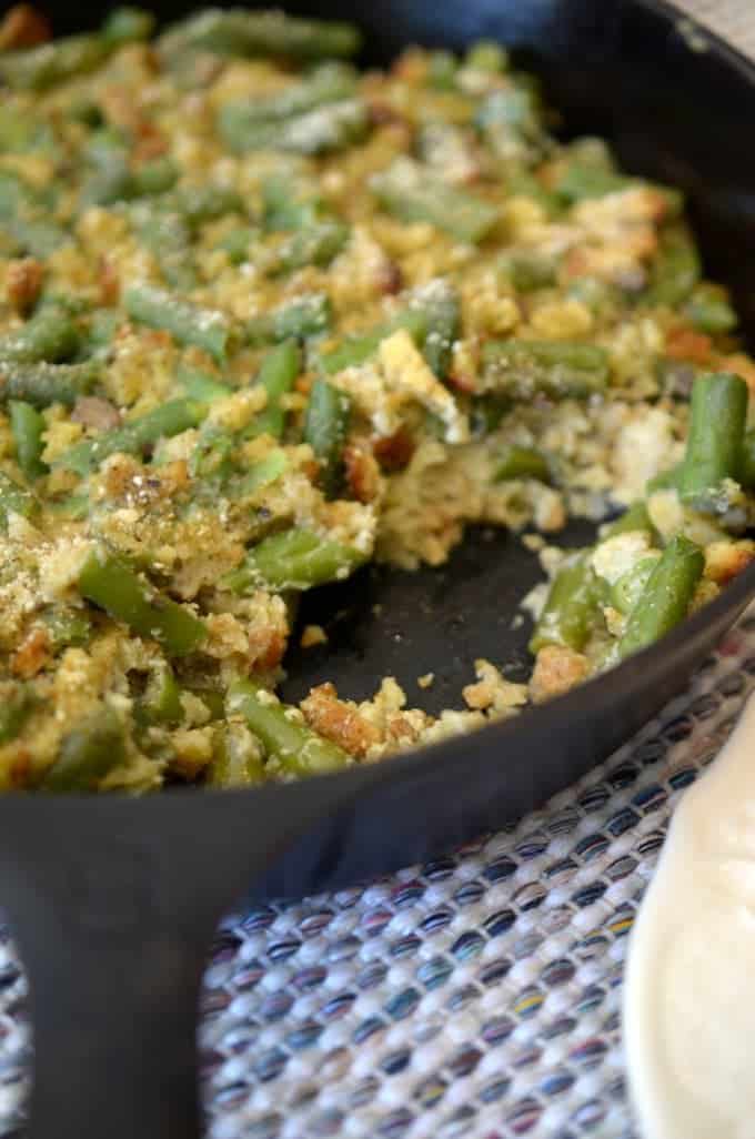 A close-up of green bean casserole in a skillet.
