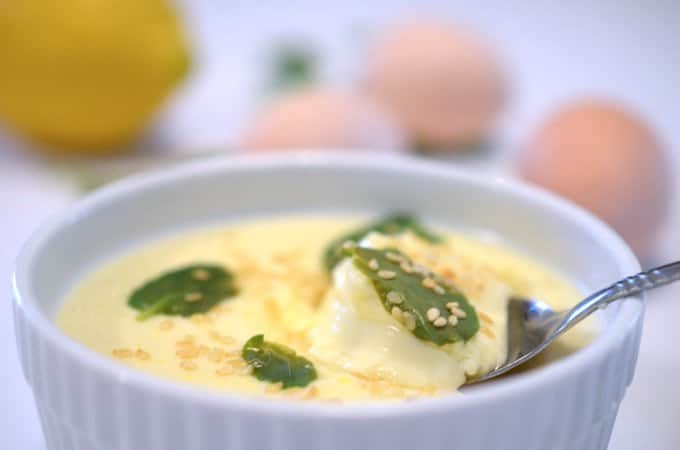 a bowl of soup with a spoon in it.