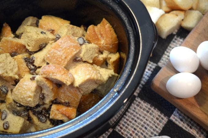 A crockpot with bread and raisins