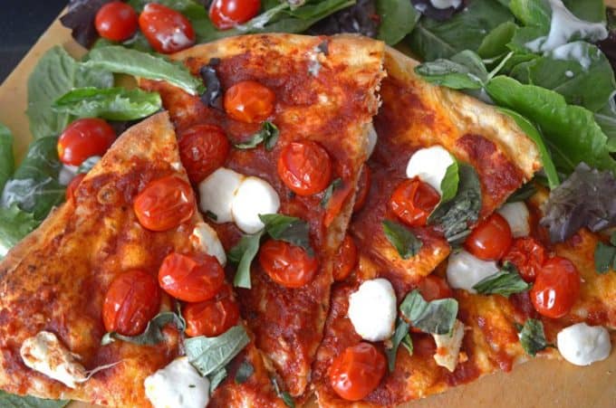 This easy Margherita pizza recipe goest together in about 30 minutes.