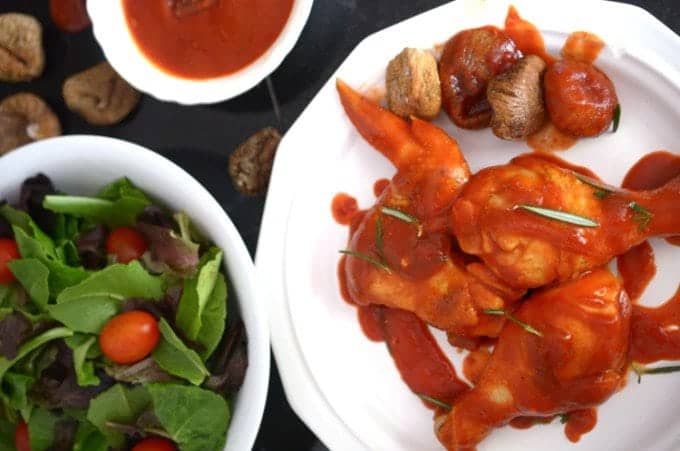 a plate of barbecue chicken.