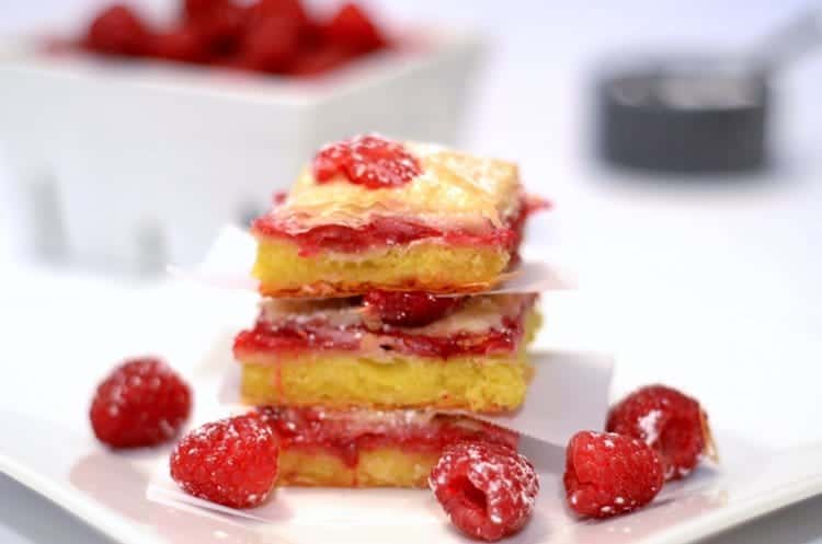 A close up of a stack of Raspberry Brownie Baklava squares.
