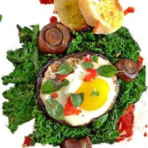 A sunny side-up egg on a bed of kale.