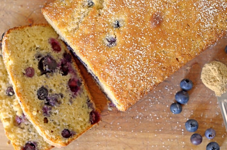 Top view of blueberry bread with two slices cut off.