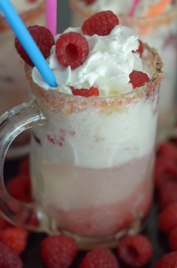 A mug with an ice cream float and straw.