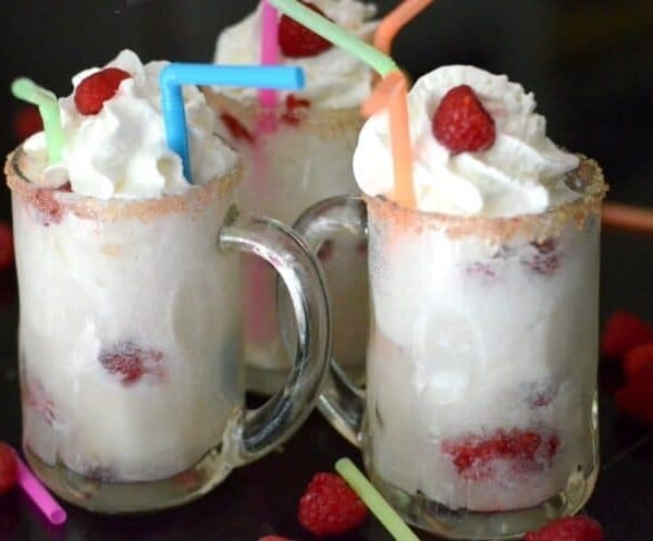 A close up of a glass of raspberry ice cream.