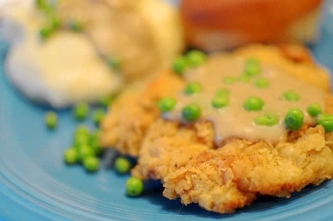 A close-up of a plate of chicken fried steak.