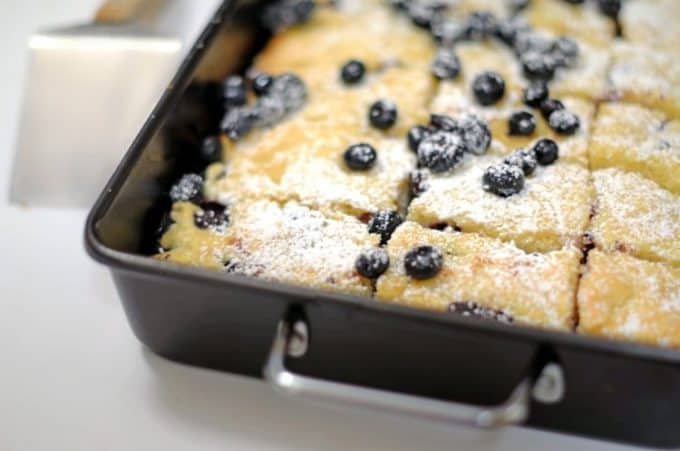 a close up of blondies in a tray.