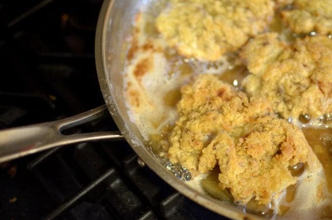 A pan-cooking chicken fried steak.