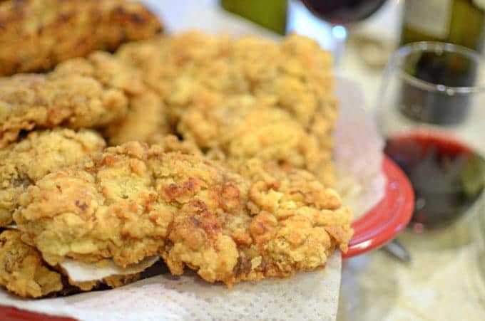 Chicken fried steak on a paper towel, draining.