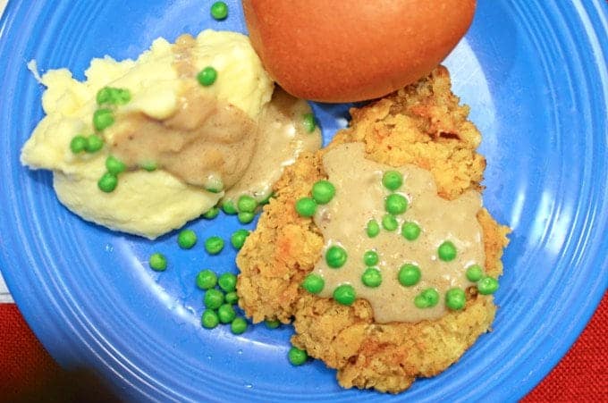 chicken fried steak with mashed potatoes on a plate.