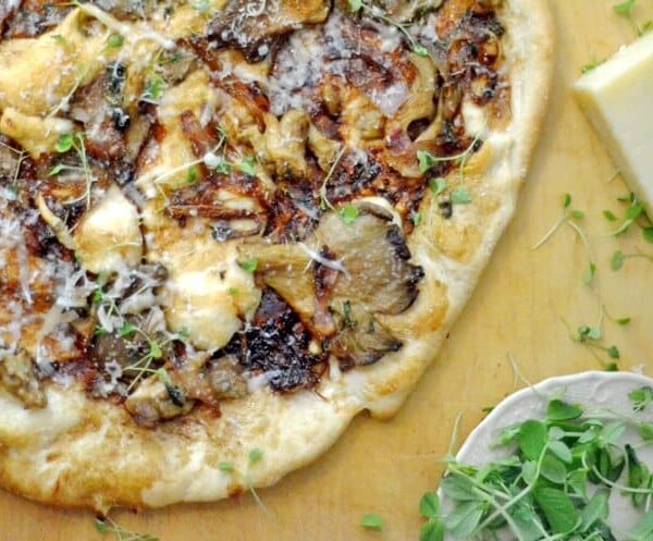 A pizza sitting on top of a cutting board.