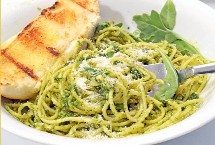 A bowl of pesto pasta.