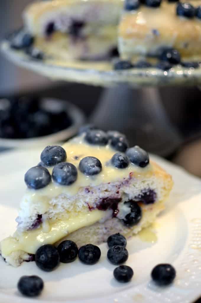 a slice of blueberry cake with icing