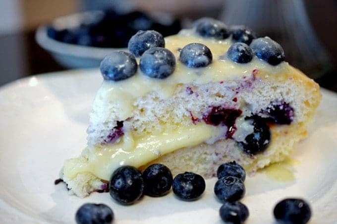 a close up of blueberry cake on a plate