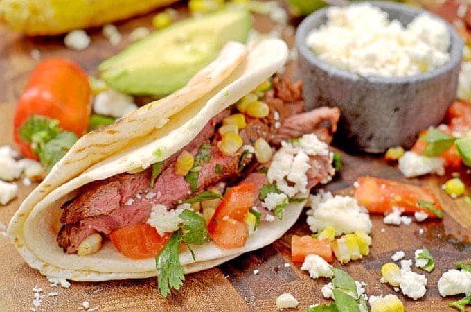 steak taco with toppings on a plate