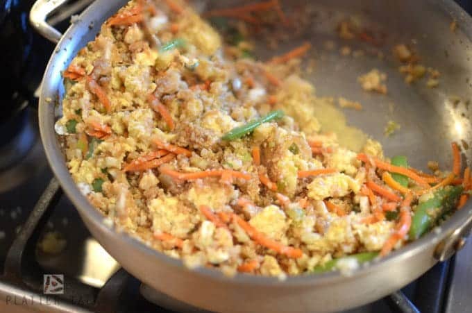 A pan filled with Fried rice.