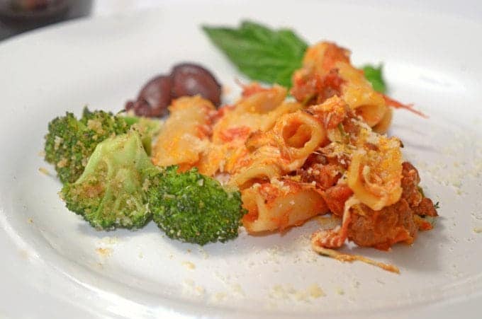 a plate of noodles and broccholi