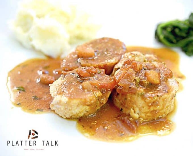 A plate of food, with apple butter and Pork