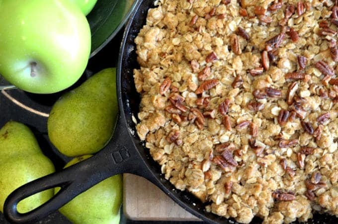 A pan filled with food, with pears