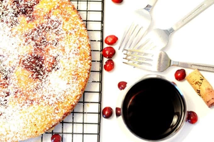 A close up of a plate of food, juice and cake