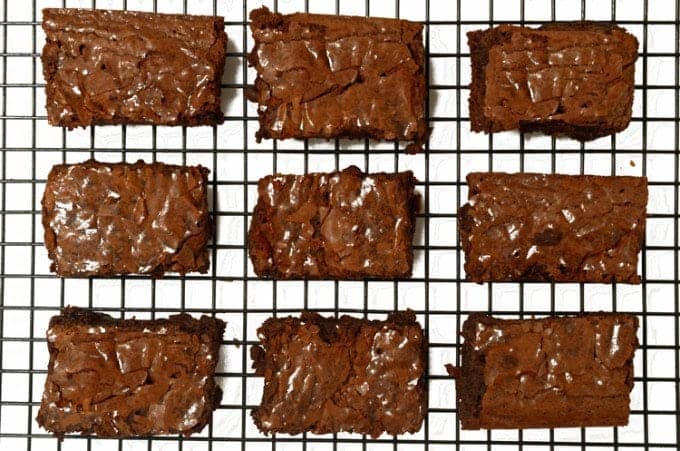 A bunch of brownies on a cooling rack