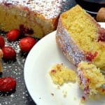 A piece of food on a plate, with Cake