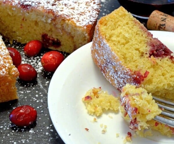 A piece of food on a plate, with Cake