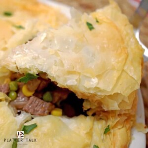 A close up of a plate of beef pot pie