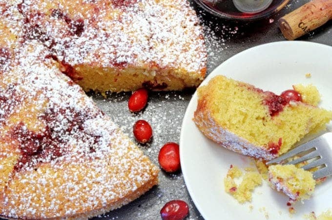 A plate of cake with cranberries