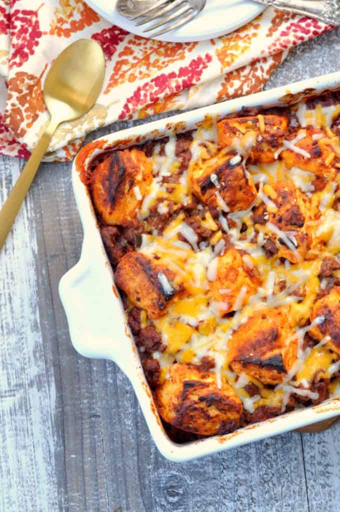 Ariel view of cheesy casserole on table with fork